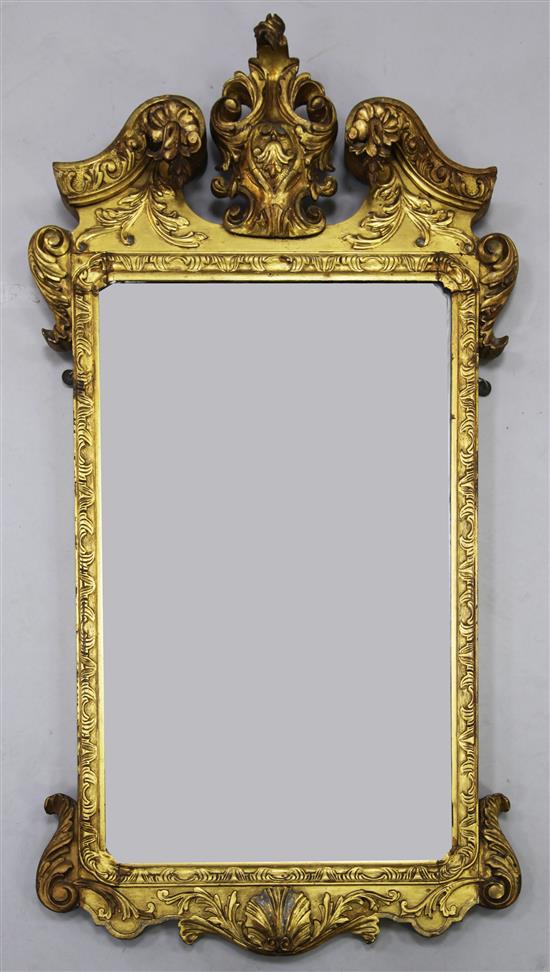 A George II style carved giltwood wall mirror, the plate 2ft 5in. x 1ft 5in.